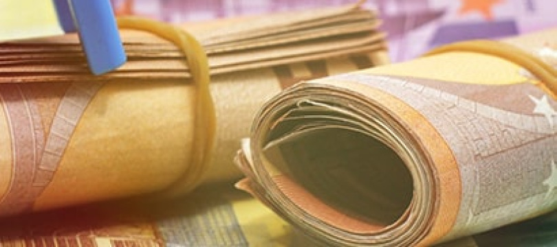 Rolled banknotes representing bonds and fixed income investments