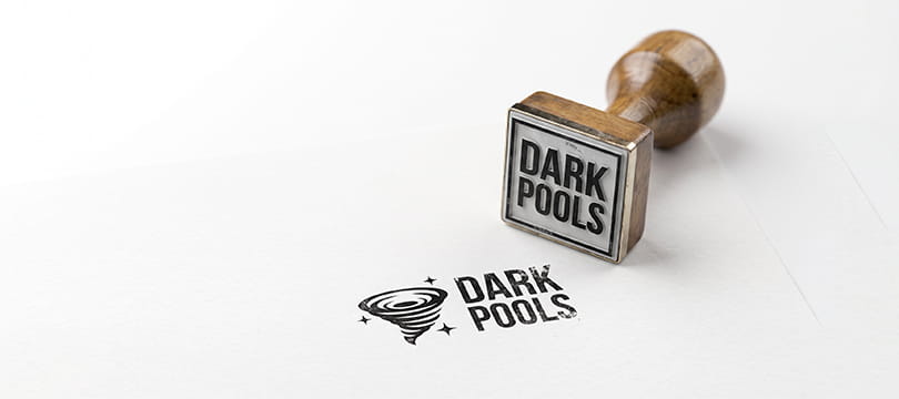 A rubber stamp with the words DARK POOLS next to its inked imprint on white paper
