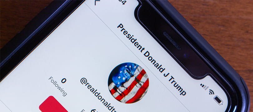 Donald Trump's social media profile shown on a smartphone screen